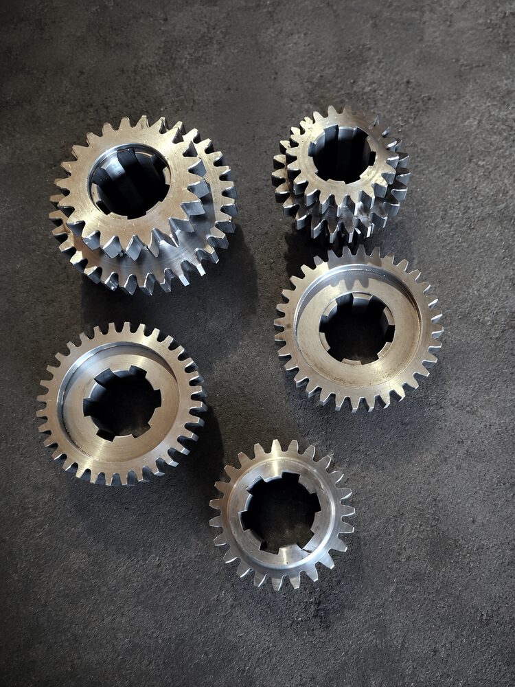Set of small steel pinion gears